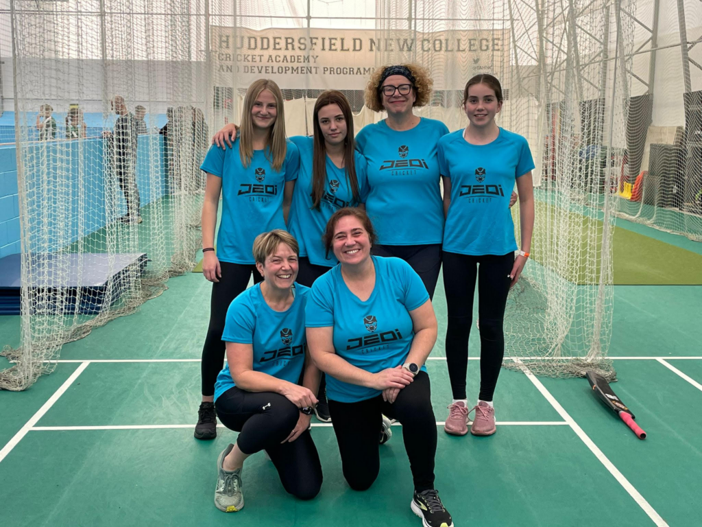 The women playing winter indoor softball cricket